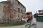 Stanislaw S. showing what remains of the synagogue. The synagogue was built in the 17th century.  © Cristian Monterroso/Yahad-In Unum